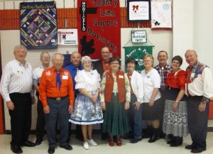 Beaux & Belles retrieved their banner from County Line Squares!