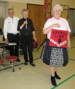 Queen Mavis retrieving the County Line Squares banner!