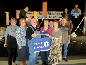 Single Circles retrieved their banner from Westonka Whirlers.