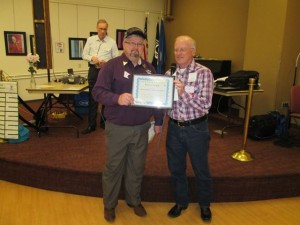 Monte accepted the certificate and 501(c)(3) documentation for Kaleidoscope Squares.