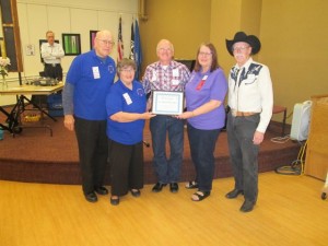 Floyd, Judy, Barb, and Larry received the certificate and 501(c)(3) documentation for St. Peter Squares.