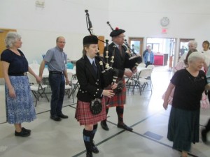 Bagpipers led the grand march of almost 20 squares!