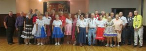 Dancers with Caller Monte Guenzler.