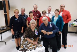 Spares & Pairs Queen Evonne and King Clem with all the callers and cuers present.